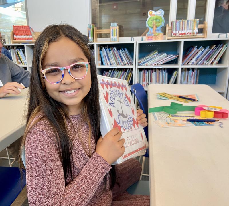 H.O. Brittingham Elementary third-grader Delilah Torres-Garcia displays her binder chock-full of work completed throughout the year at the school’s second annual Leadership Day. ELLEN DRISCOLL PHOTOS